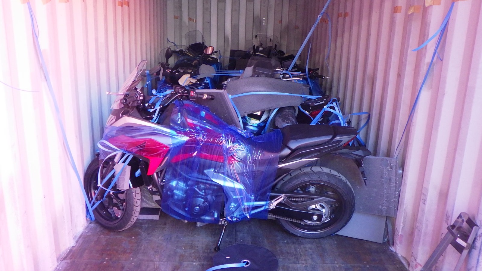 Motorcycles strapped and secured for sea freight